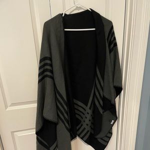 Reversible black/grey poncho-style sweater.